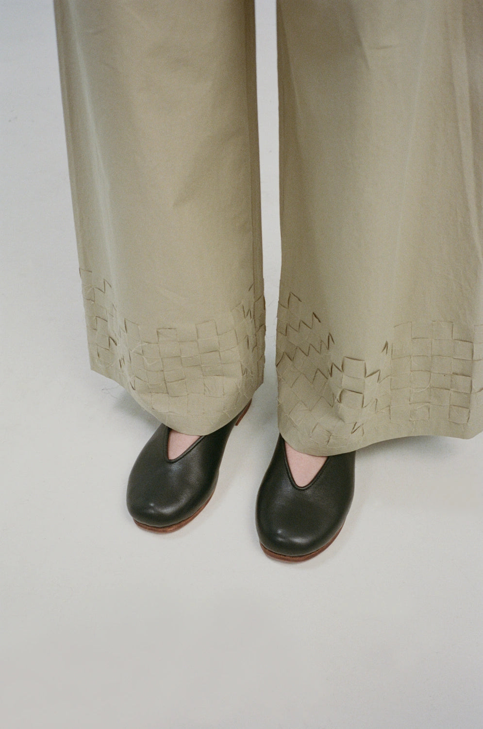 model wearing shay pants handwoven square texture hem detail
