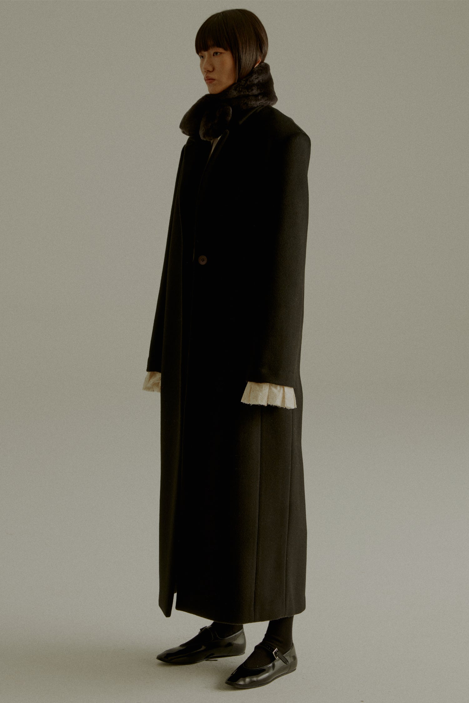 UNISECON AW23 CHARLIE COAT - Super Fine Wool, Long Black Coat, Laced Cuffs - side