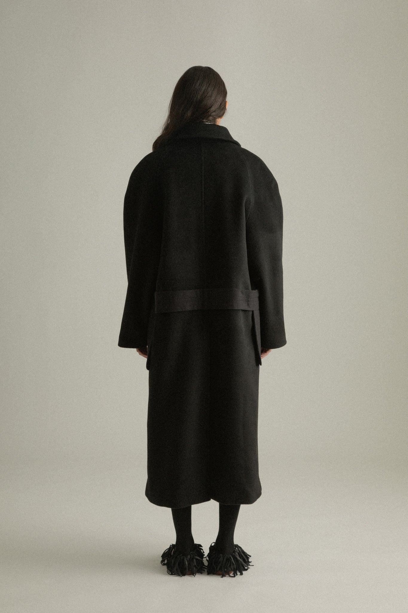 Alma Coat back view featuring the structured notched collar and relaxed tailoring.