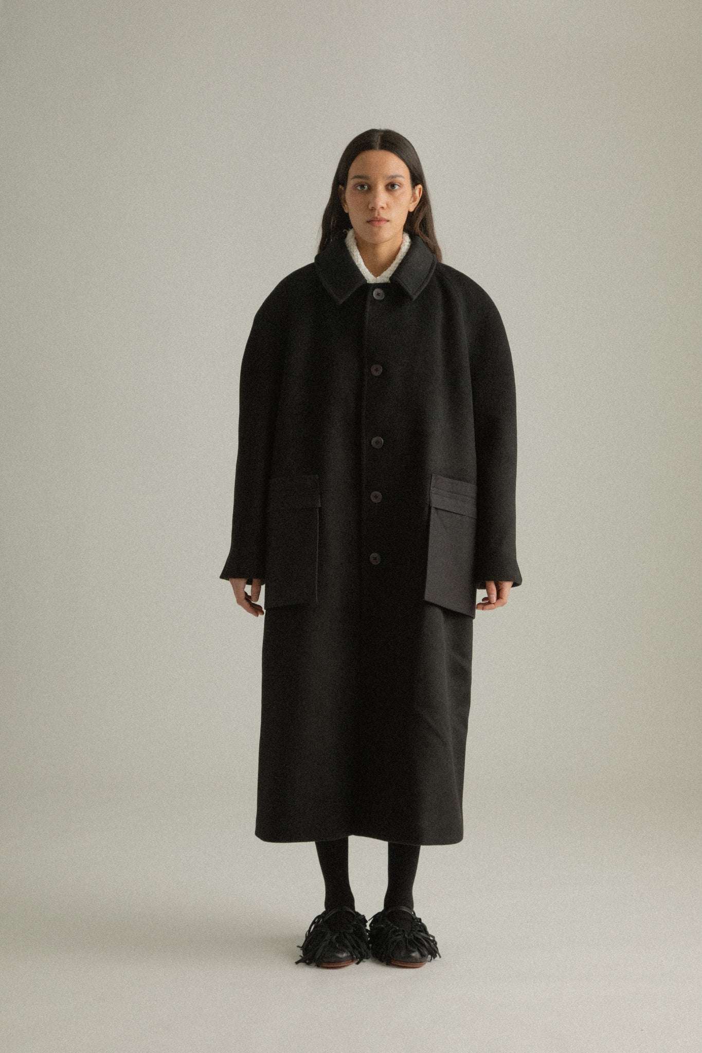 Alma Coat full-body front view, relaxed-fit in superfine wool and organic cotton blend with a notched collar and side seam pockets.