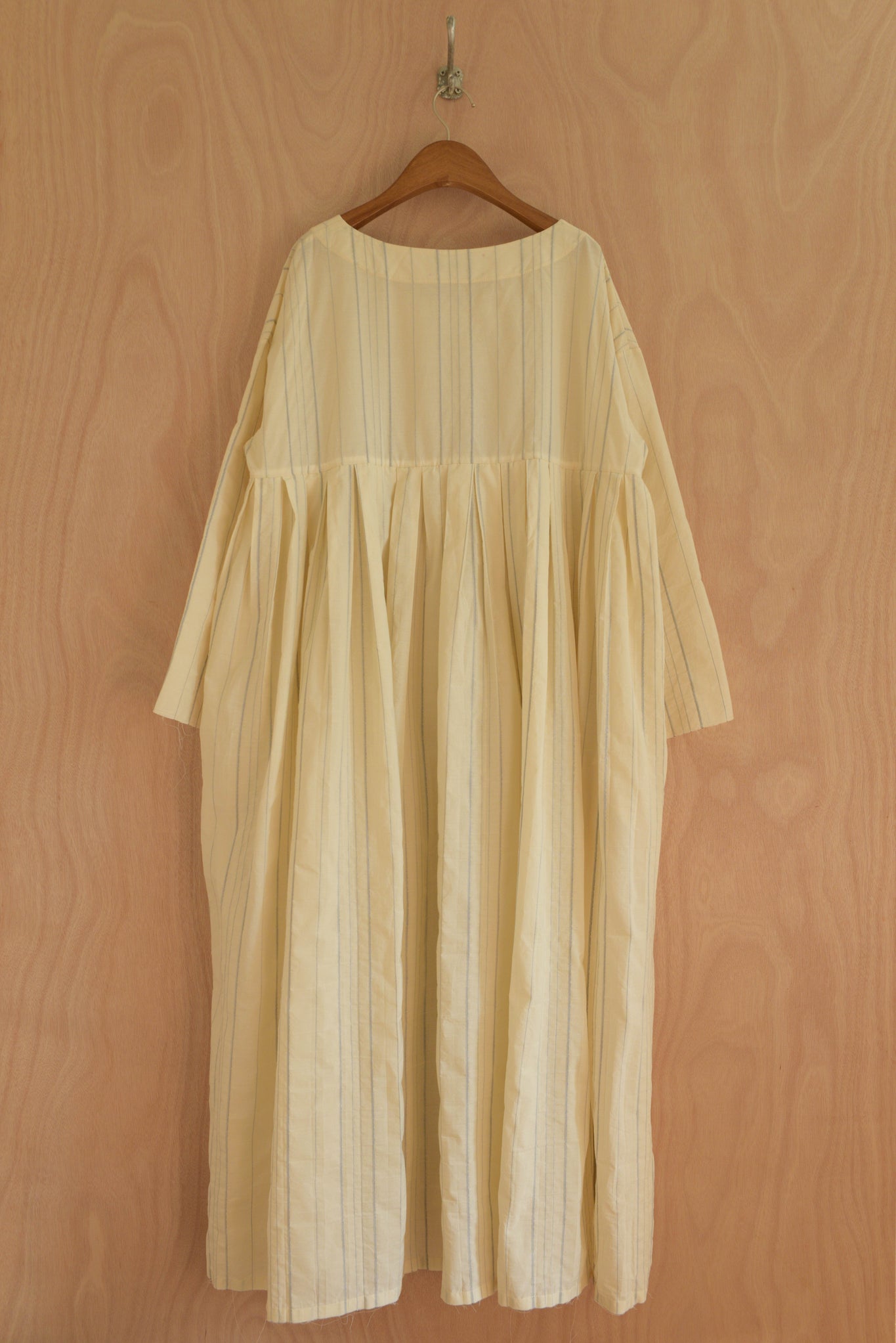 Arya Dress back view showing relaxed drape and reversible construction