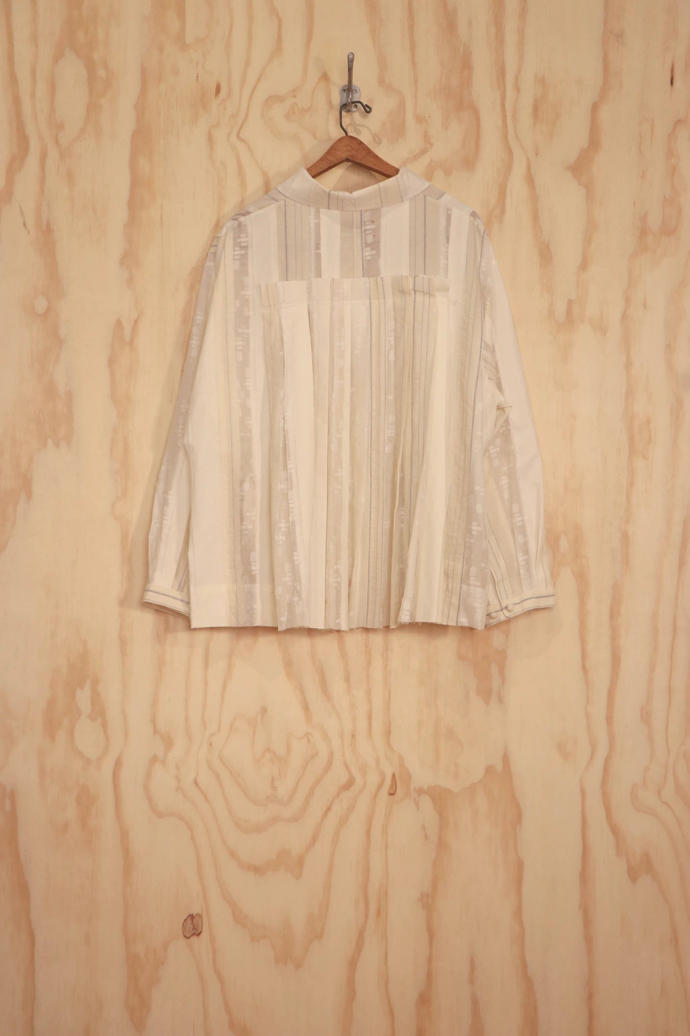 Bea Top back view showing pleated panel and patchwork seam.