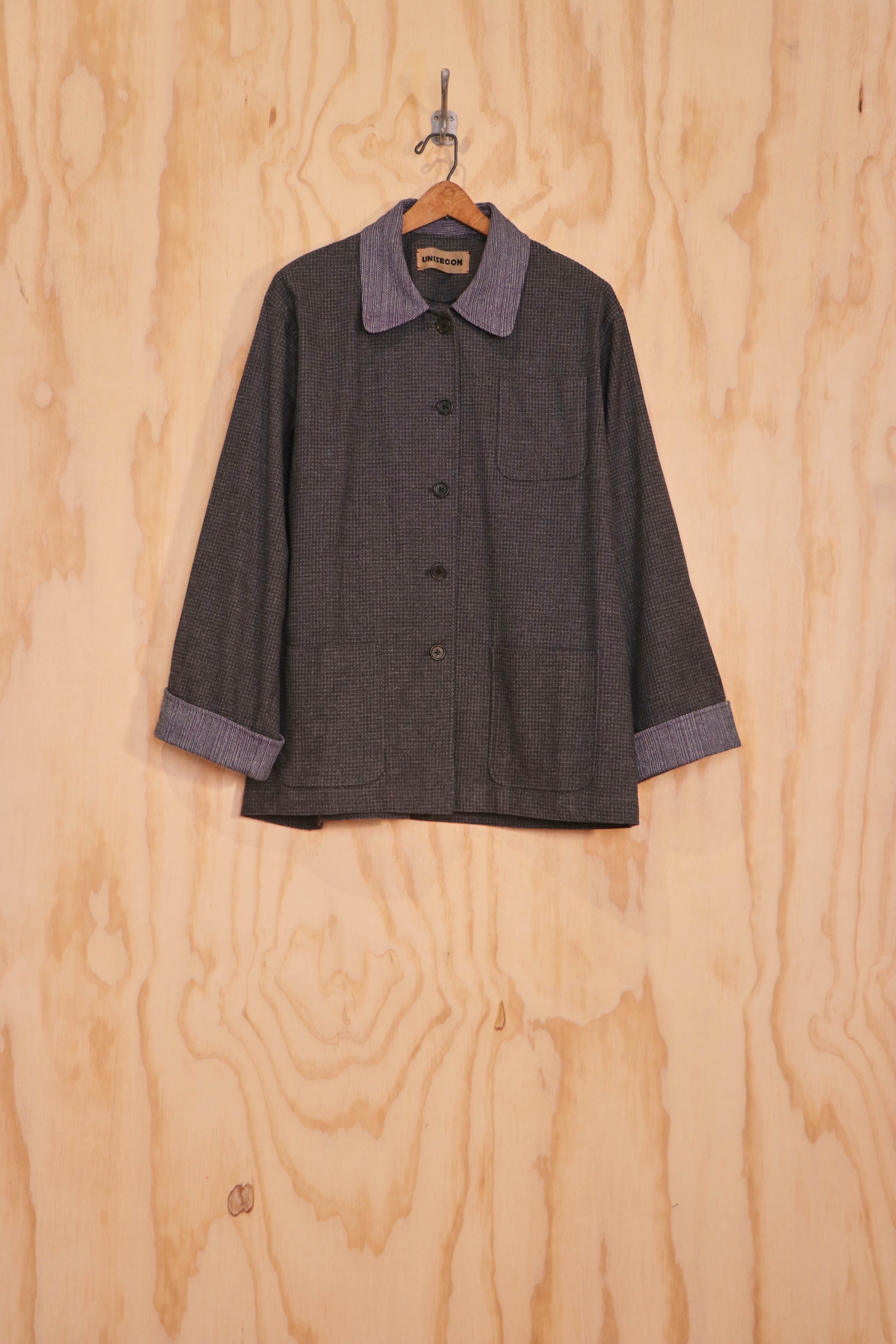 Front view of Jae Jacket in charcoal linen–cotton with lilac collar and cuffs, hand-tied closures