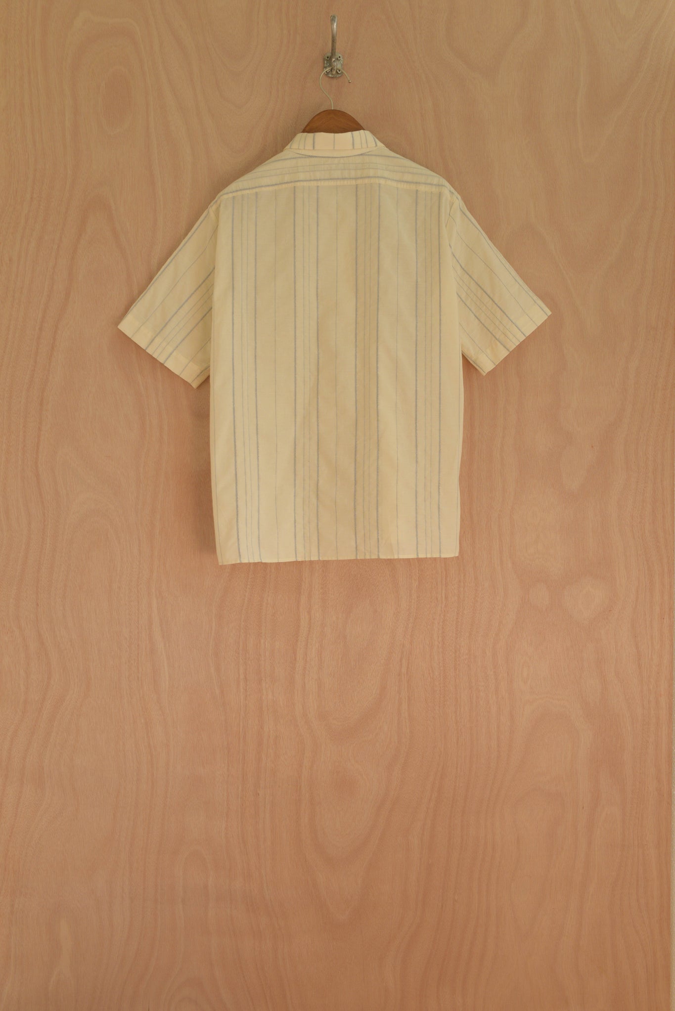 Close-up of hand-woven front patch and in-house striped fabric