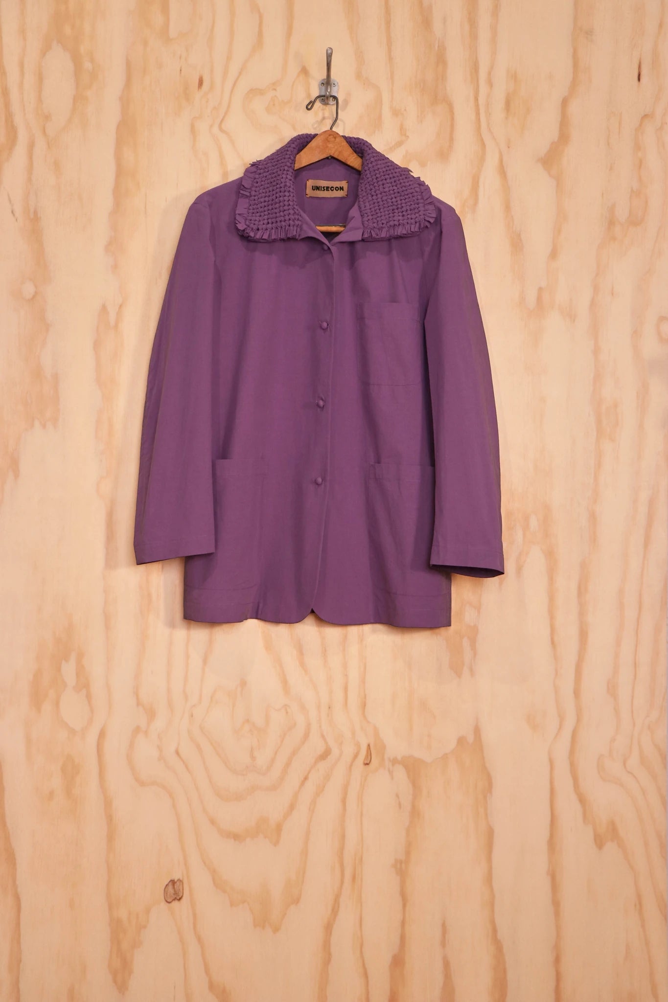 Front view of Kayo Top in purple organic-cotton with gathered stand collar