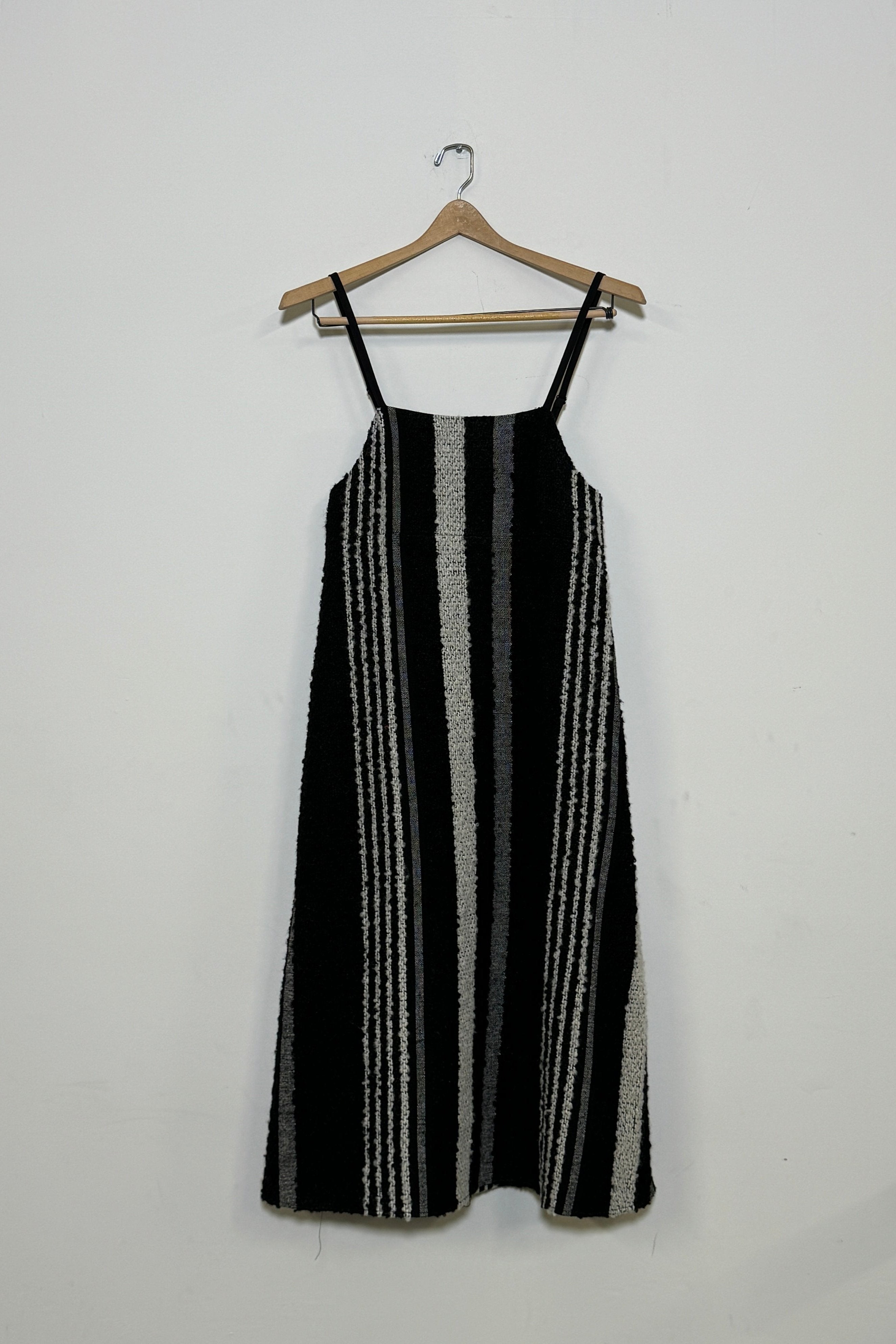 The Lena Dress, crafted from a blend of mohair and wool, features a straight silhouette with delicate straps and a quilted patchwork design. Shown in front, side, and hanging views to highlight the dress’s full shape and texture.