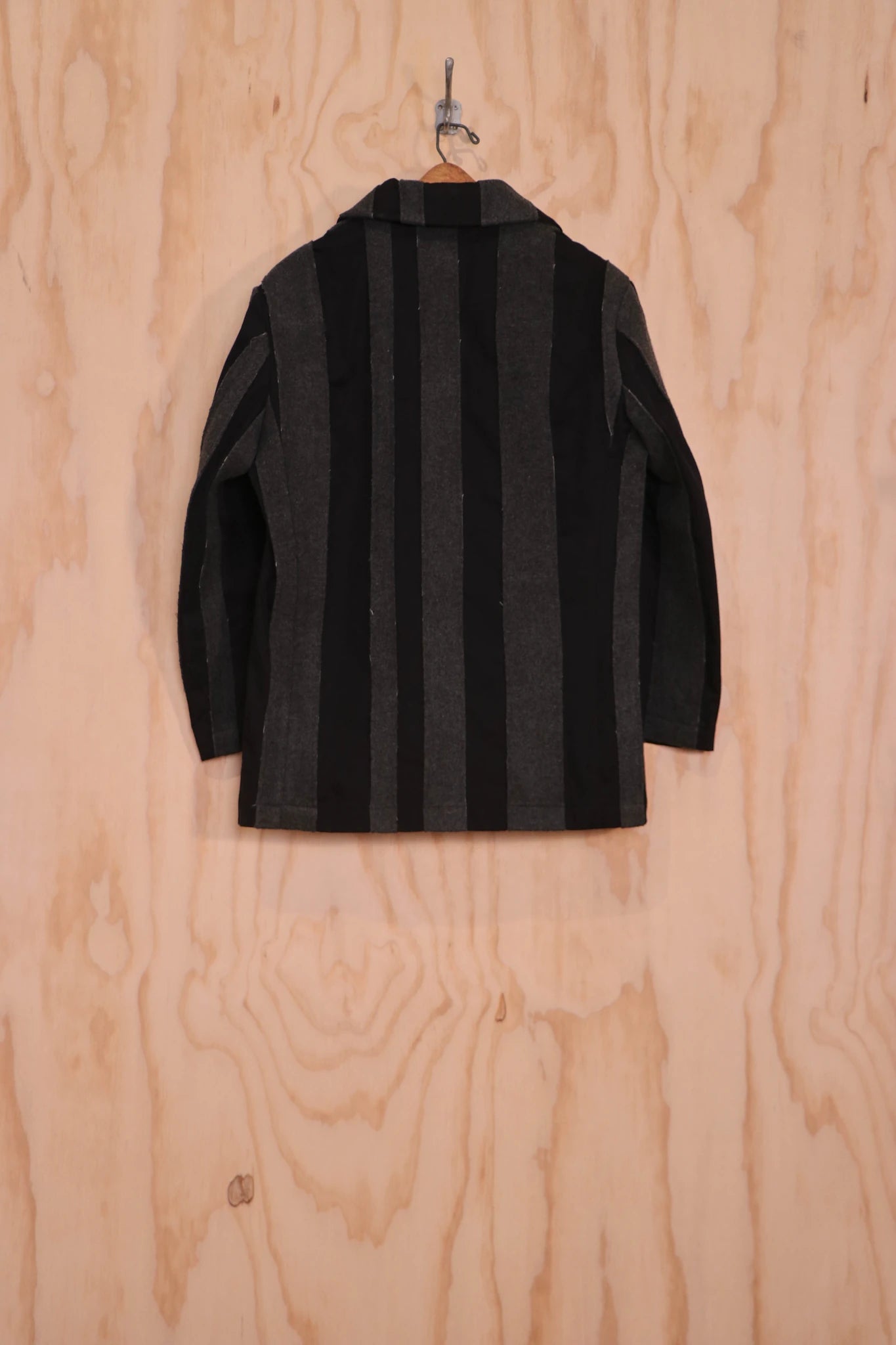 Back view showing stripe pattern and boxy cut