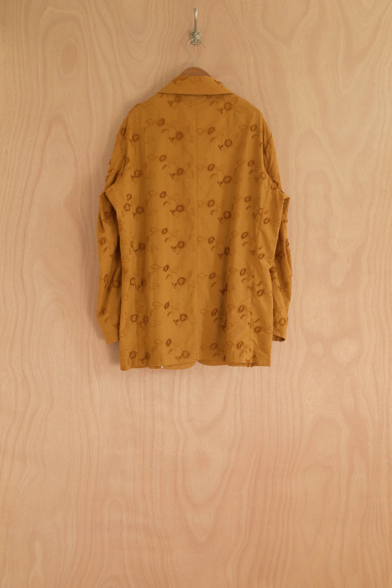 Back view of Nicole Jacket showing relaxed structure and full embroidery