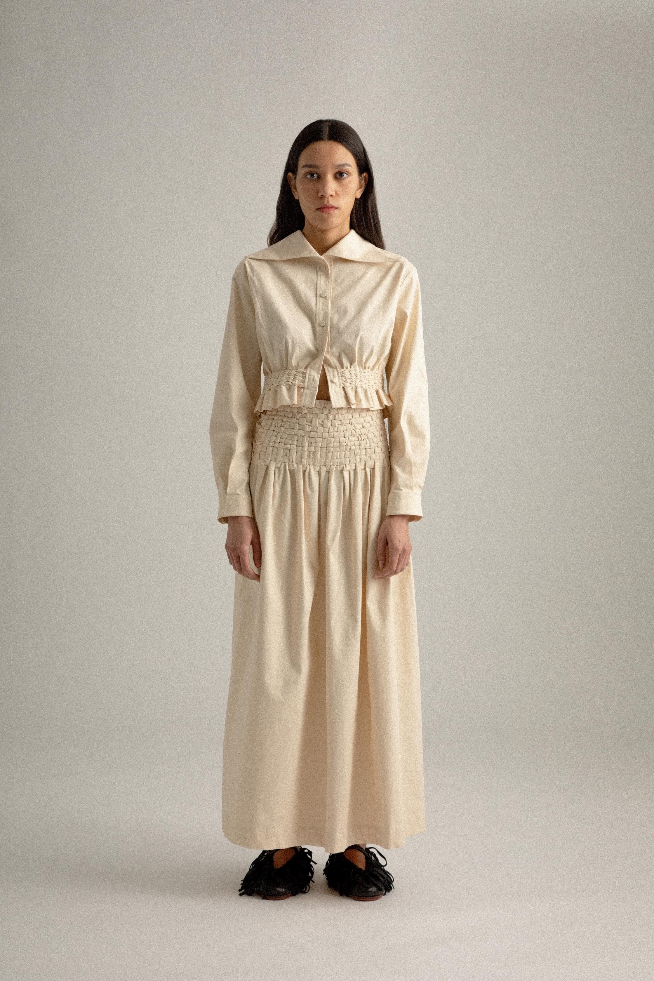 sylvie skirt showing hand-woven waist panel and hand-set pleats