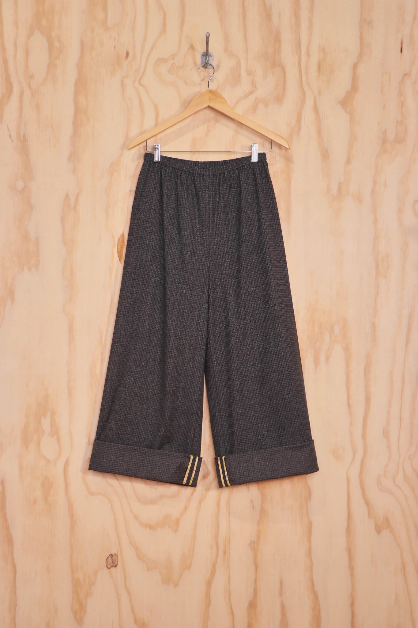 Tess Pants in grey linen-cotton, front view on hanger.