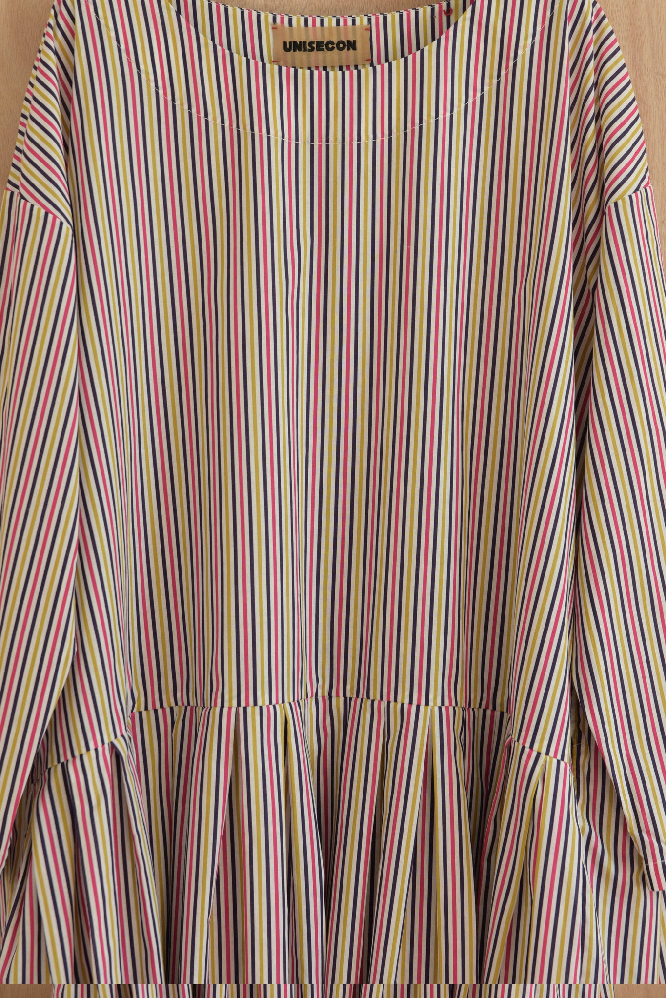 Close-up of multicolor striped fabric on ULA top