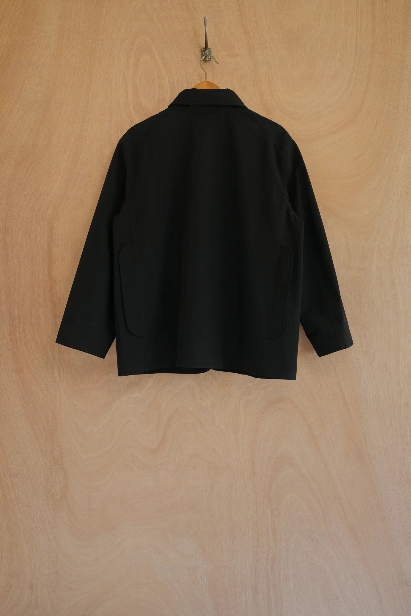 UNISECON eddy jacket in black, back view