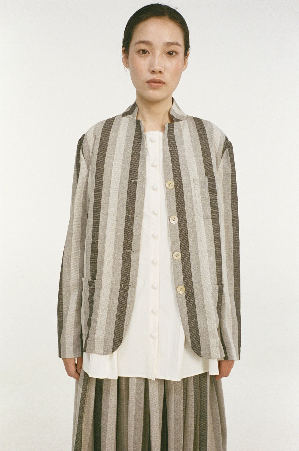 unisecon-patch-jacket-grey-stripes-front-closeup