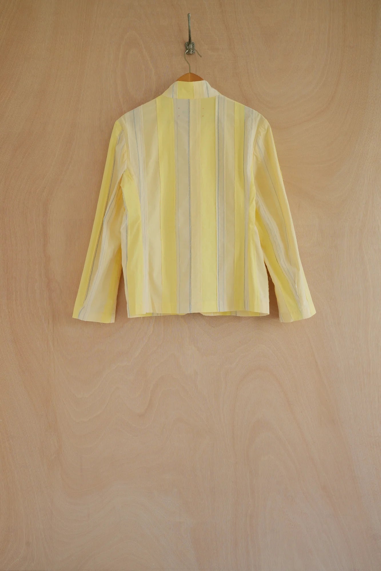 UNISECON Patcha jacket in yellow, back view 1