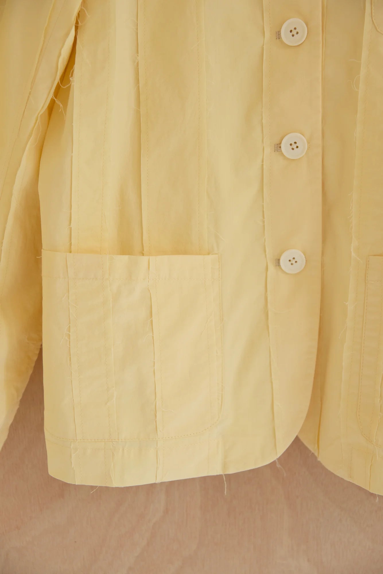 UNISECON Patcha jacket in yellow, detail view