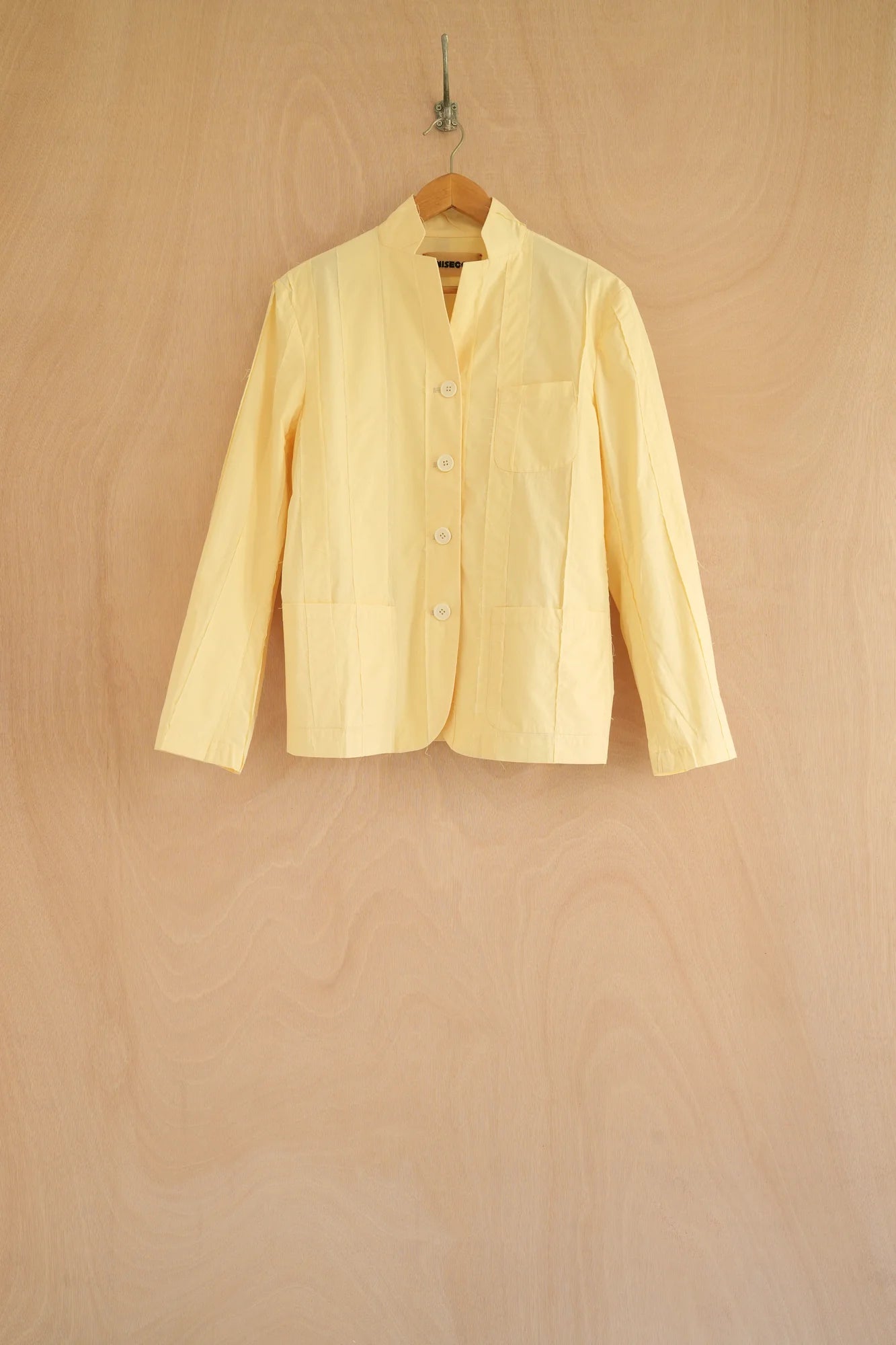 UNISECON patcha jacket in yellow, front view