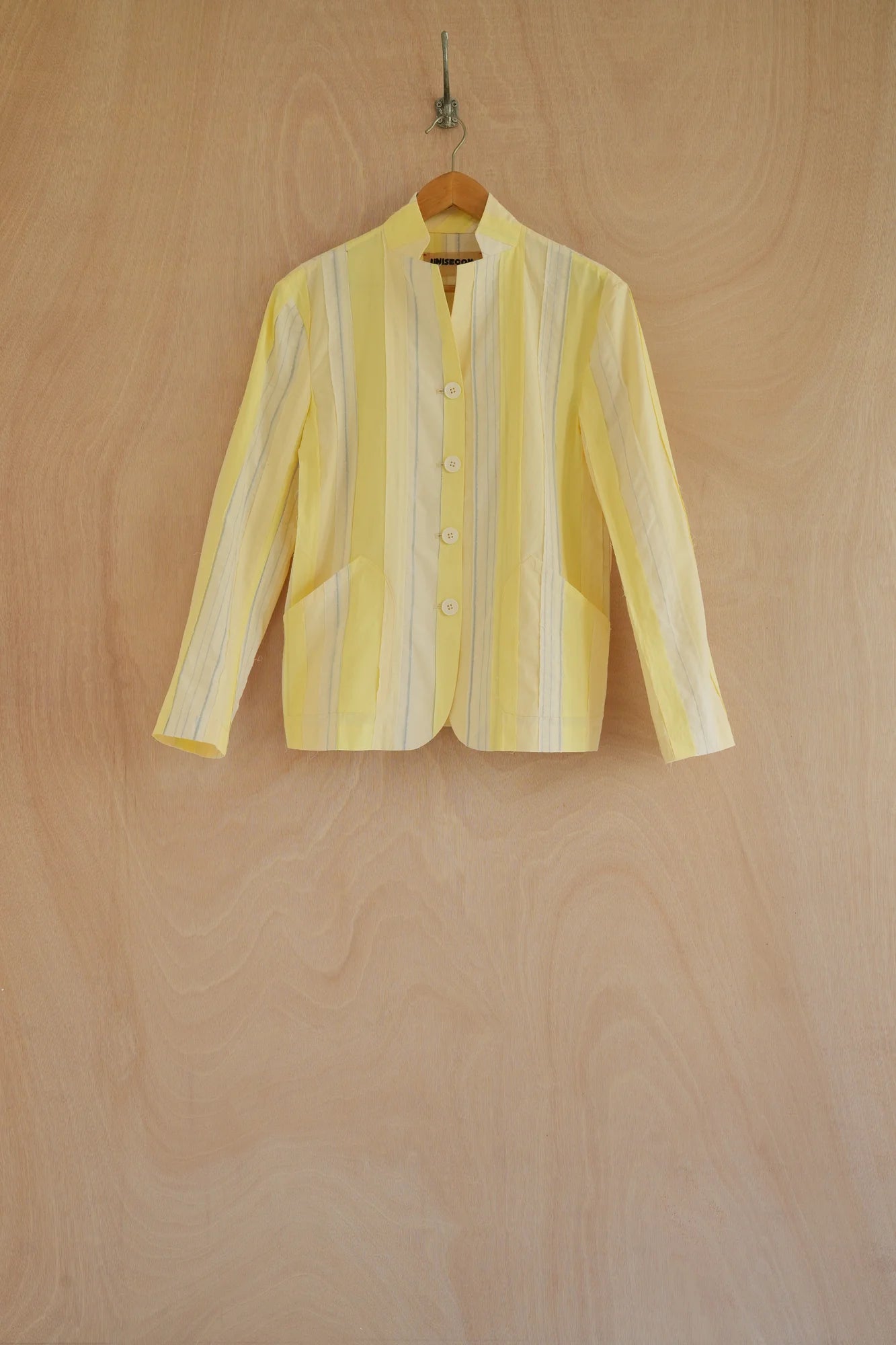 UNISECON Patcha jacket in yellow, front view 1