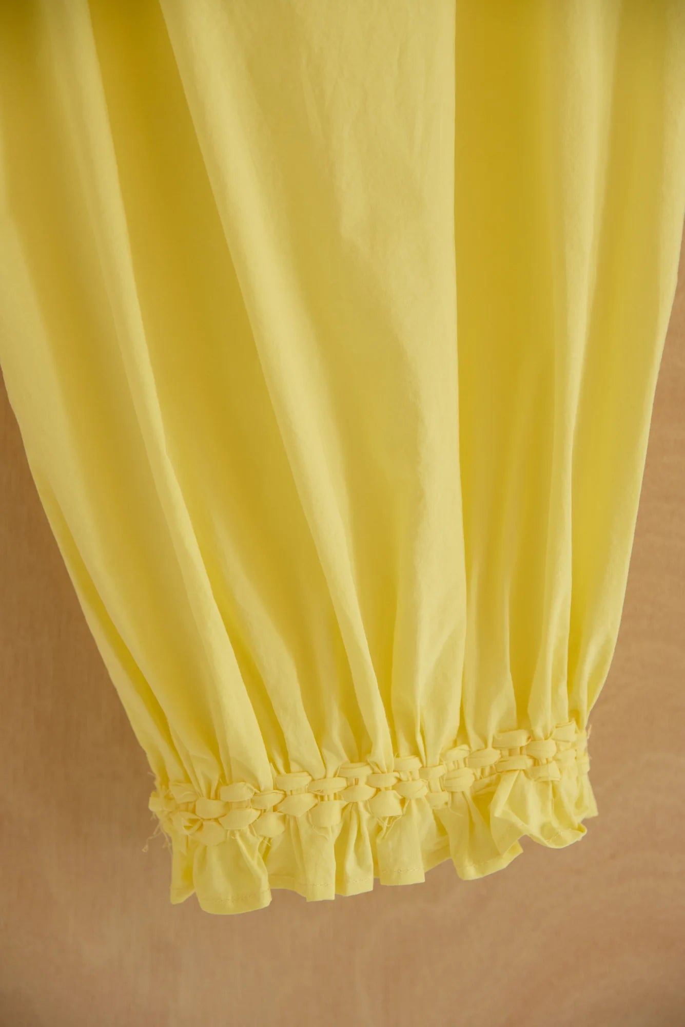 UNISECON Qira pants in yellow, detail view