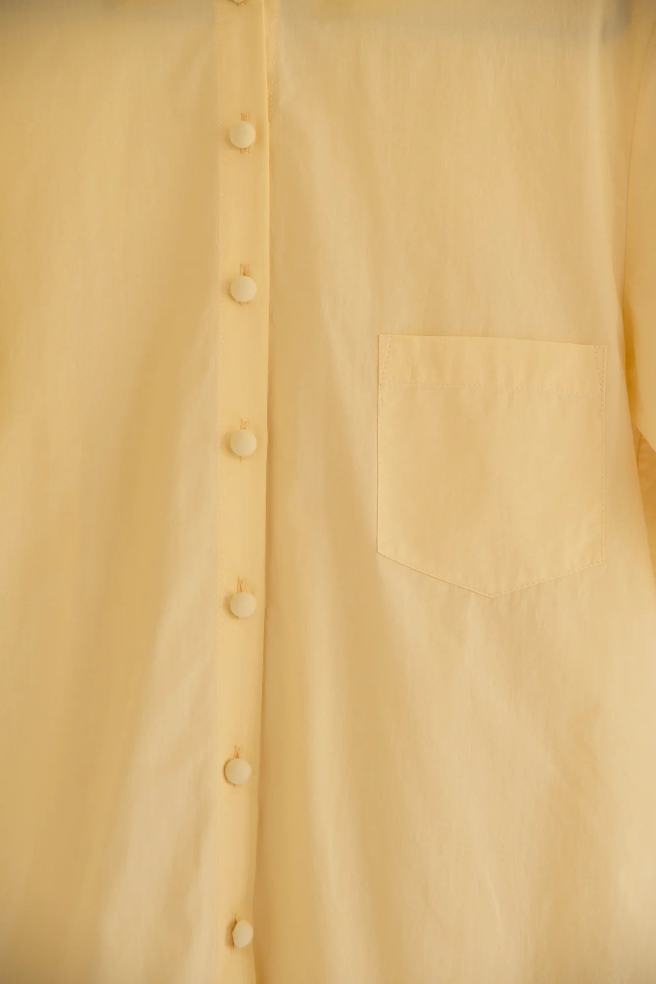 UNISECON Wei top in yellow, detail view