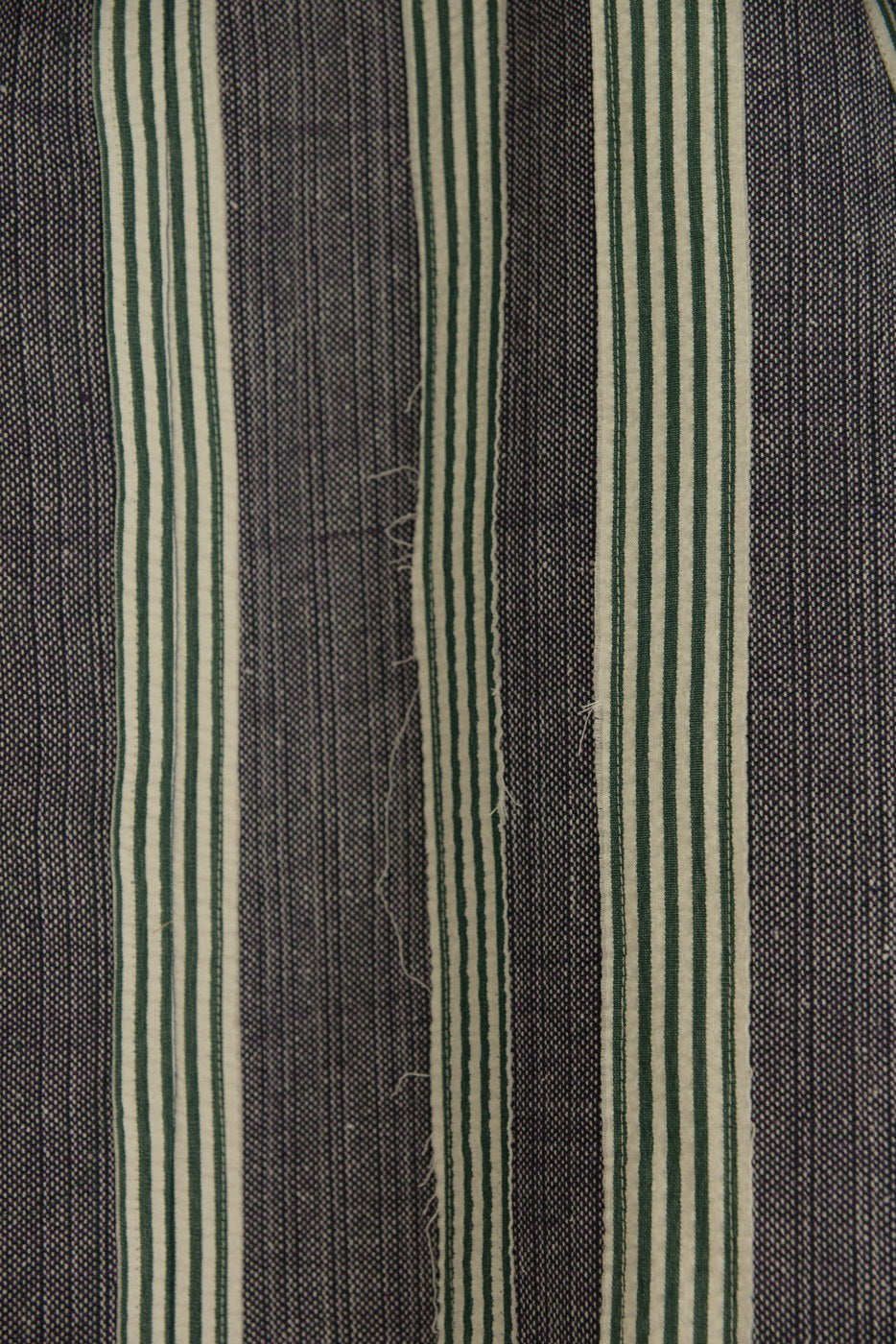 joined strips of contrasting cloth in a unisecon garment